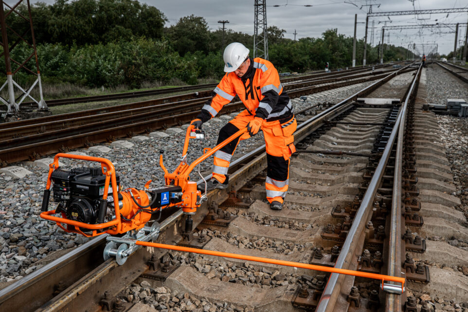 Track worker with universal power wrench
