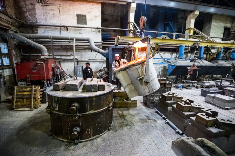 foundry workers prepare equipment